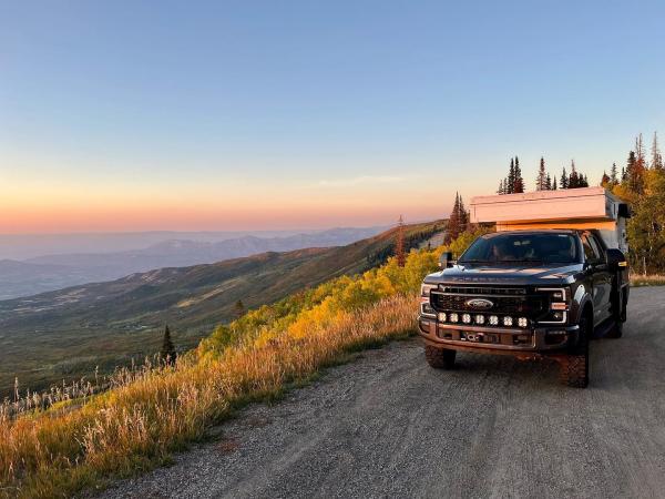 Truck and Camping Tent on Dirt Road