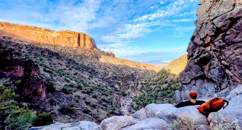 Man Sitting on a Rock in Colorado National Monument