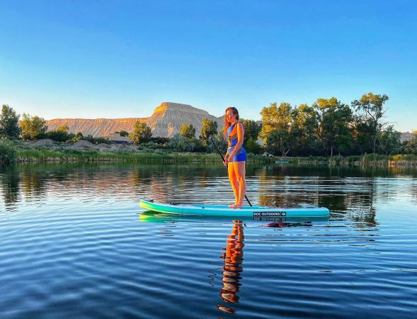 A Girl Stand Up Paddle boarding