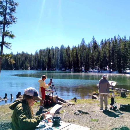 Three people plein air painting on the Grand Mesa