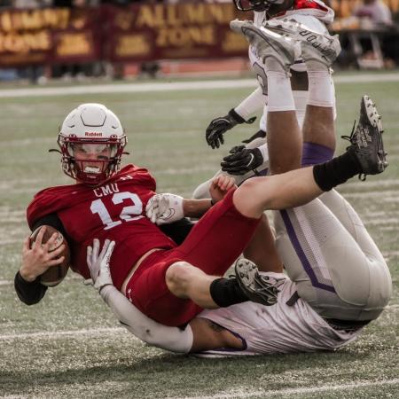 CMU Football Player being Tackled