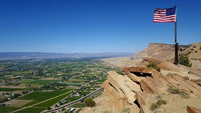 American Flag Waving Above the Grand Junction Area on the Book Cliffs