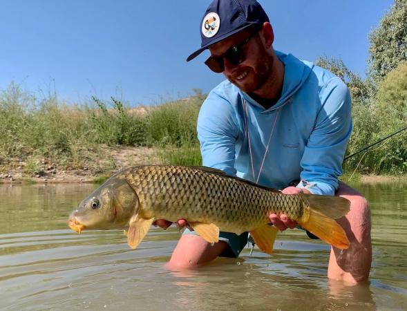 Man Holding Large Carp