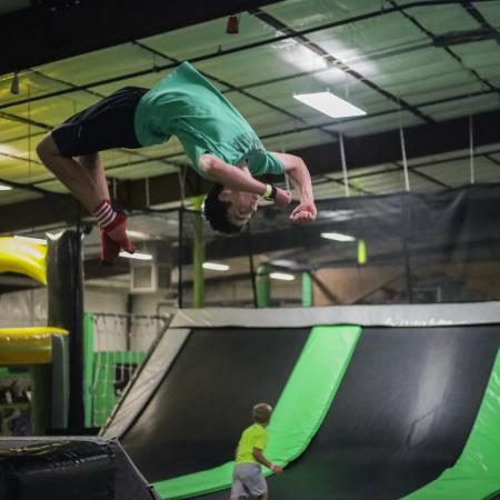Kid Doing a Backflip at Get Air