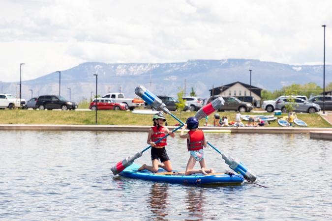 kids playing on the water at the Butterfly Pond at Las Colonias Park