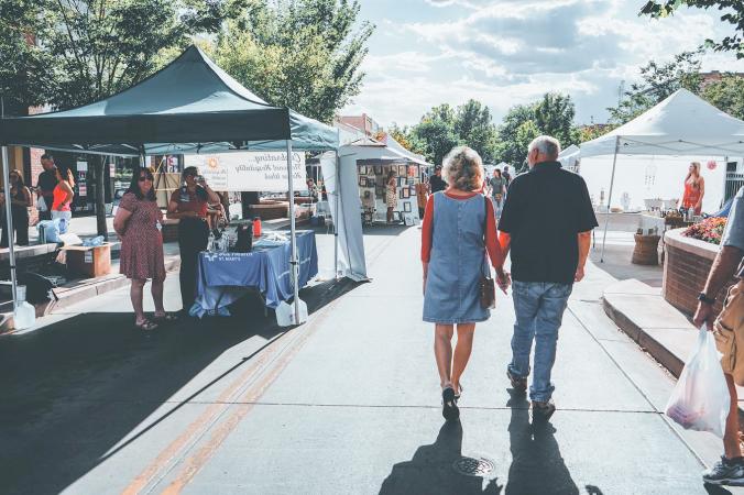 A Couple walking down Main Street for Market on Main