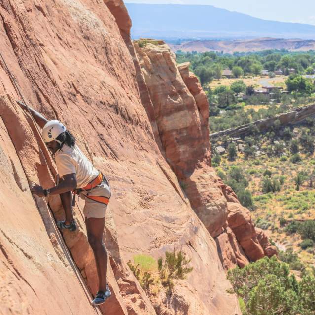 Person Rock Climbing in Grand Junction