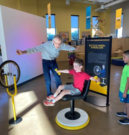 Child Interacting with an Exhibit at Eureka! Science Museum