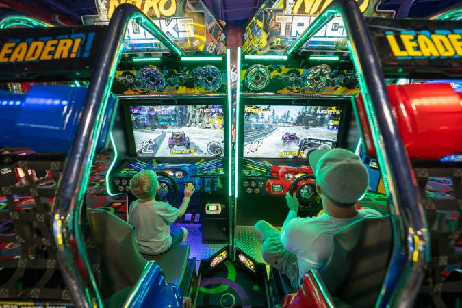 Dad and Son playing Arcade Game at Bananas Fun Park