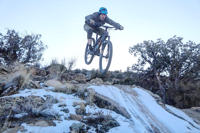 Mountain Biker Jumping in the Winter