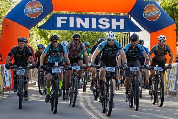 Picture of People Crossing the Finish Line in a Bike Race