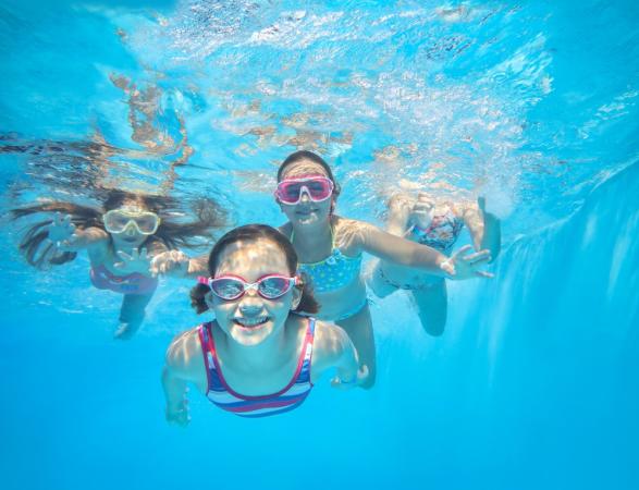 Kids Swimming in a Pool
