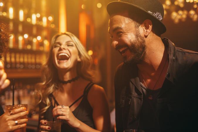 Picture of People Laughing Together in a Bar