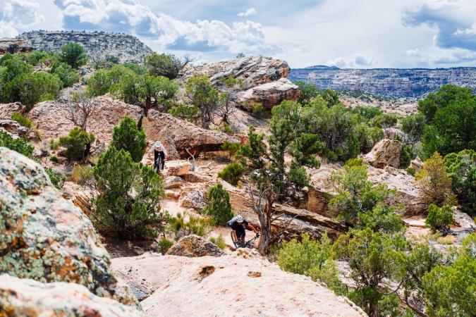 Two Mountain Bikers Riding in Lunch Loops Trail Area