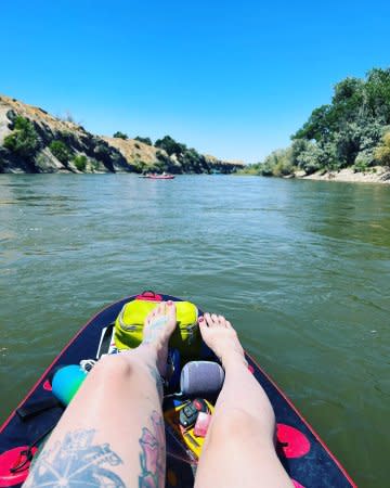 Woman sitting on Paddle Board on Colorado River