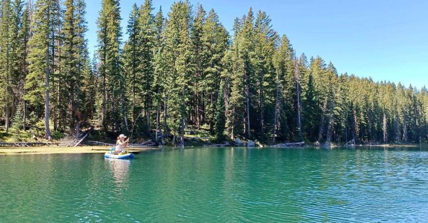 Woman Fly Fishing on a Paddleboard on The Grand Mesa