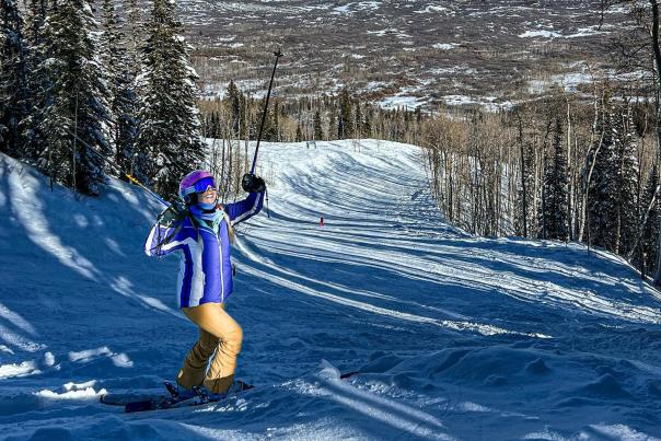 Woman Skiing Down Powderhorn Mountain Resort
