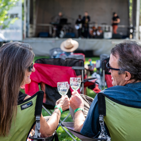 Picture of Two People Sitting Outside Drinking Wine